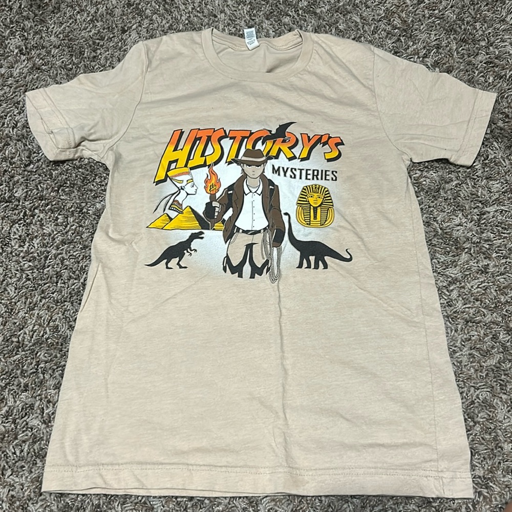 Tan t shirt with design. Size is small and brand is CANVAS